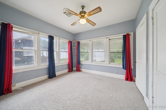 1414 E 8th St, Okmulgee, OK 74447 - unfurnished bedroom with carpet floors and a ceiling fan