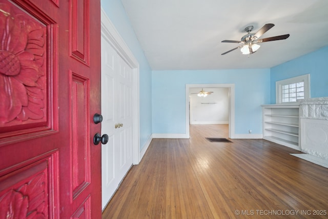 1414 E 8th St, Okmulgee, OK 74447 - foyer with a ceiling fan and wood finished floors