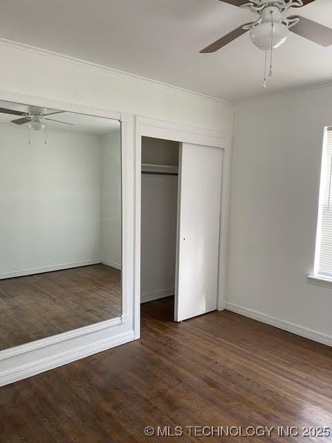 4746 S Boston Pl, Tulsa, OK 74105 - unfurnished bedroom featuring dark wood-style flooring, crown molding, and a ceiling fan