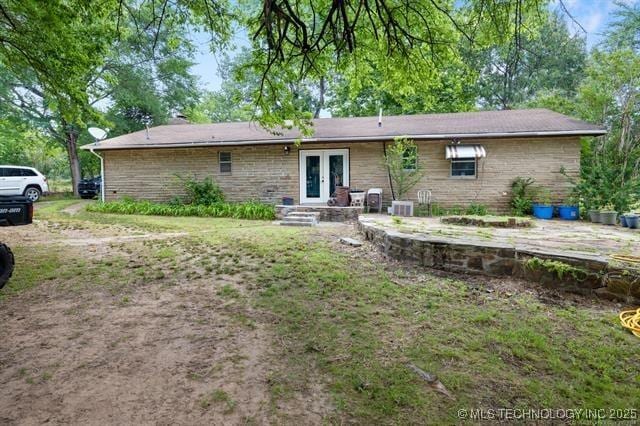 528 Stephens Rd, Eufaula, OK 74432 - rear view of property with french doors and brick siding
