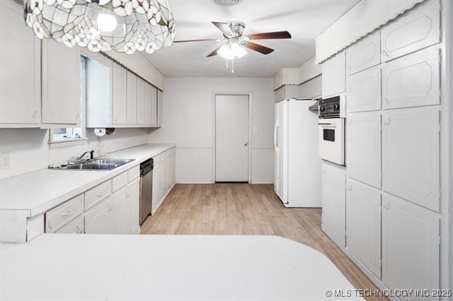 528 Stephens Rd, Eufaula, OK 74432 - kitchen featuring white appliances, light countertops, white cabinets, and light wood finished floors