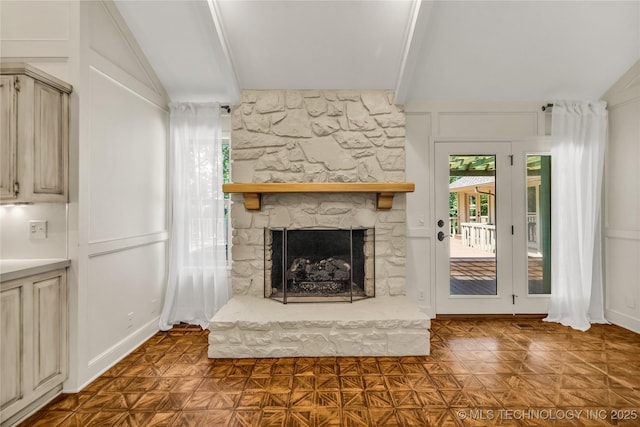 9916 S Quebec Ave, Tulsa, OK 74137 - unfurnished living room with a fireplace and a decorative wall