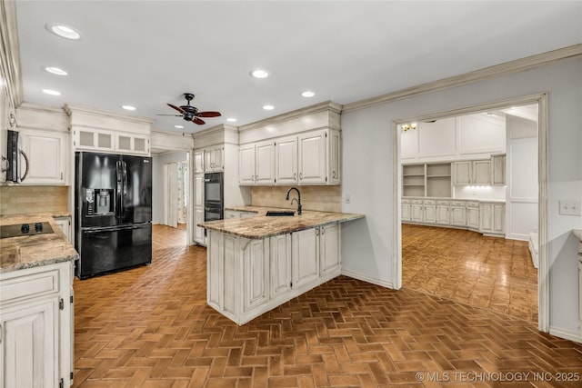 9916 S Quebec Ave, Tulsa, OK 74137 - kitchen featuring black appliances, a ceiling fan, a peninsula, tasteful backsplash, and light stone countertops