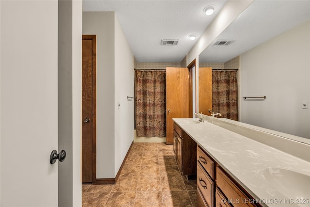 9916 S Quebec Ave, Tulsa, OK 74137 - full bath with double vanity, a shower with curtain, and tile patterned floors