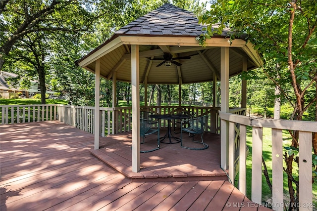 9916 S Quebec Ave, Tulsa, OK 74137 - wooden deck with a gazebo, ceiling fan, and outdoor dining space