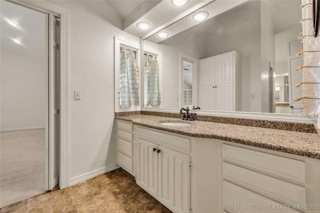 9916 S Quebec Ave, Tulsa, OK 74137 - bathroom with vanity and baseboards