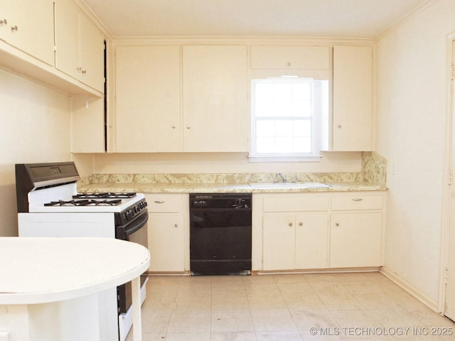 4957 S Cincinnati Ave, Tulsa, OK 74105 - kitchen with black dishwasher, white range with gas cooktop, light countertops, and cream cabinets