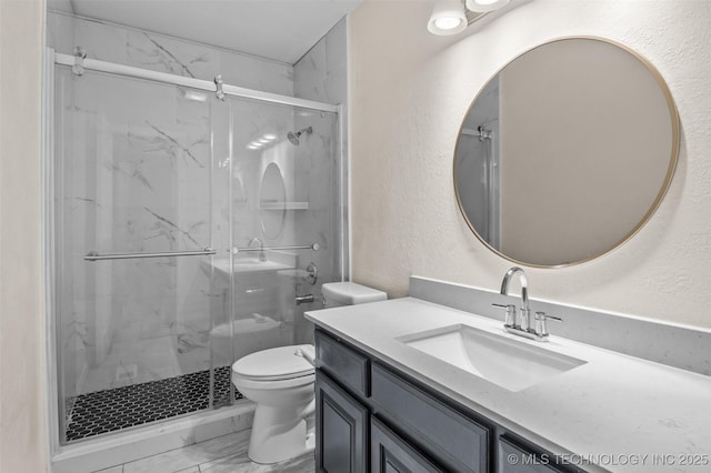8903 N 124th E Ave, Owasso, OK 74055 - full bathroom with marble finish flooring, vanity, a marble finish shower, and a textured wall