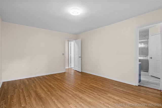 8903 N 124th E Ave, Owasso, OK 74055 - empty room featuring light wood-style floors and baseboards