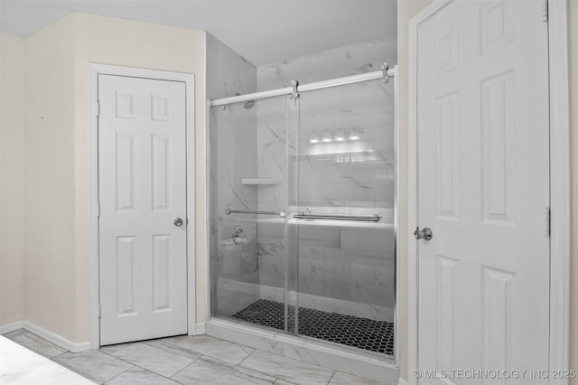 8903 N 124th E Ave, Owasso, OK 74055 - full bath featuring marble look tile flooring and a marble finish shower