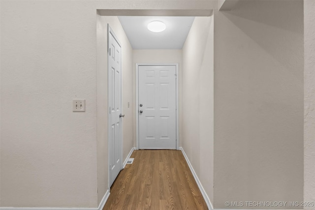 8903 N 124th E Ave, Owasso, OK 74055 - doorway with wood finished floors and baseboards