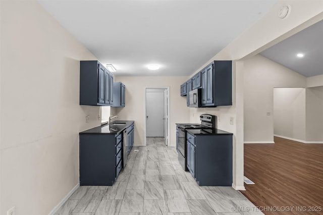 8903 N 124th E Ave, Owasso, OK 74055 - kitchen with stainless steel appliances, dark countertops, and blue cabinets
