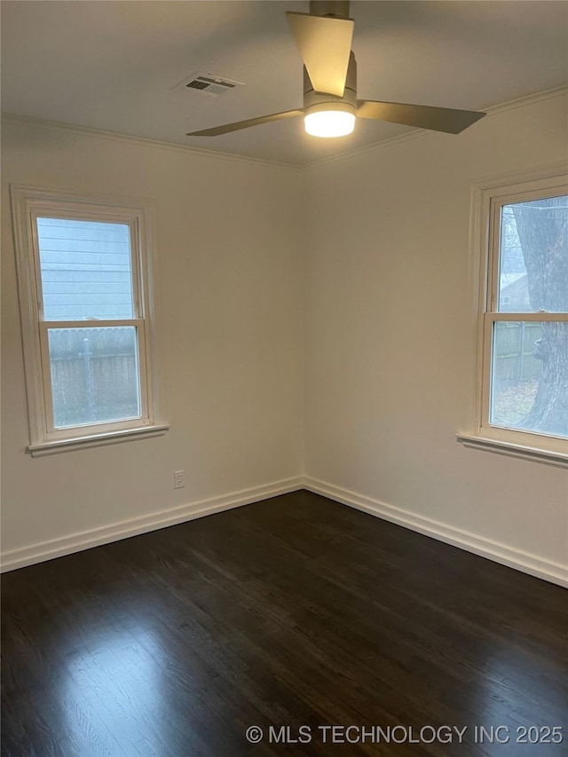 4326 S Norfolk Ave, Tulsa, OK 74105 - spare room featuring dark wood-style floors, ornamental molding, and a ceiling fan