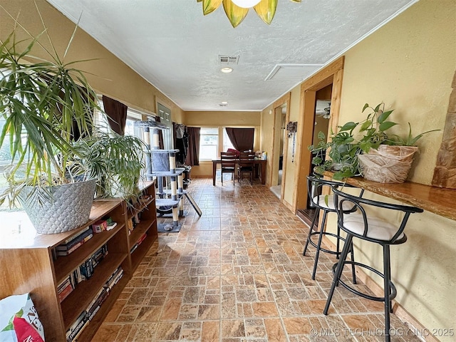 616 N Lee St, Fort Gibson, OK 74434 - corridor with brick patterned floors and a textured ceiling