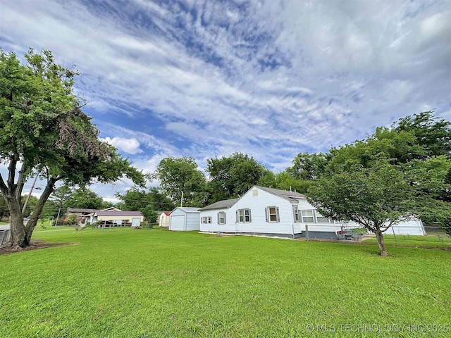 616 N Lee St, Fort Gibson, OK 74434 - view of green lawn with a storage shed