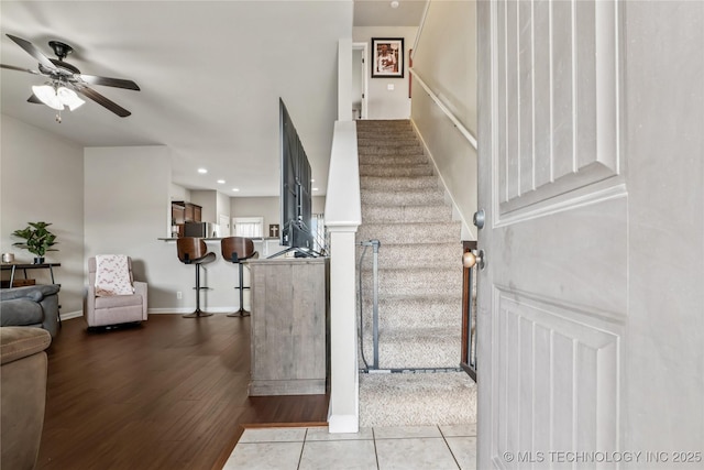 4661 E 148th St S, Bixby, OK 74008 - staircase featuring ceiling fan, wood finished floors, and recessed lighting