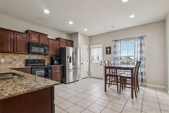4661 E 148th St S, Bixby, OK 74008 - kitchen featuring black appliances, tasteful backsplash, light stone counters, recessed lighting, and light tile patterned floors