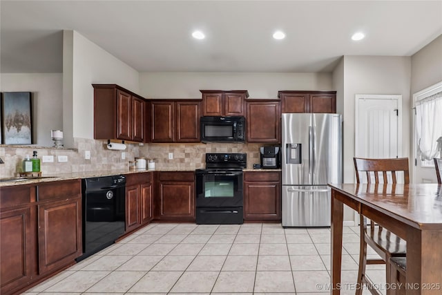 4661 E 148th St S, Bixby, OK 74008 - kitchen featuring black appliances, backsplash, light stone counters, light tile patterned flooring, and dark brown cabinets