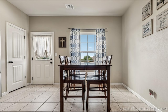 4661 E 148th St S, Bixby, OK 74008 - dining area featuring light tile patterned floors and baseboards