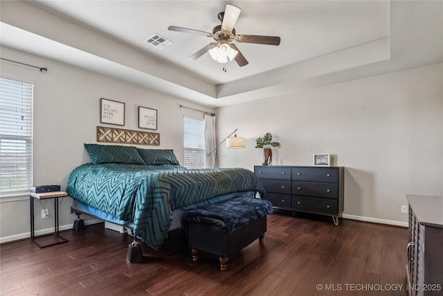 4661 E 148th St S, Bixby, OK 74008 - bedroom featuring wood finished floors, a raised ceiling, and a ceiling fan