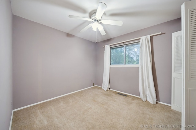 6922 E 16th St, Tulsa, OK 74112 - unfurnished bedroom featuring light colored carpet and ceiling fan