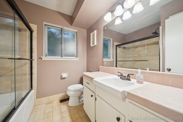6922 E 16th St, Tulsa, OK 74112 - bathroom with vanity, combined bath / shower with glass door, backsplash, and tile patterned flooring