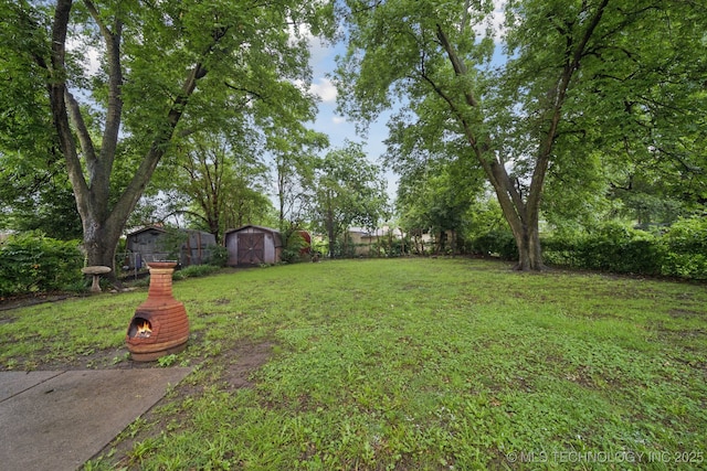 6922 E 16th St, Tulsa, OK 74112 - fenced backyard with a storage unit