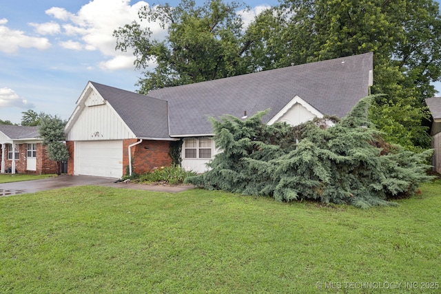 6922 E 16th St, Tulsa, OK 74112 - view of front facade featuring asphalt driveway, a front lawn, brick siding, and an attached garage