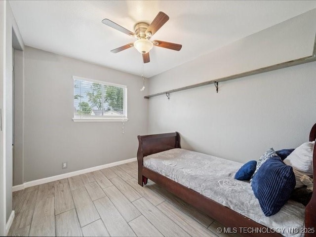 2346 S 118th E Ave, Tulsa, OK 74129 - bedroom with light wood-style floors and a ceiling fan