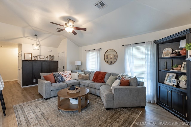 1113 S Spinnaker Dr, Oologah, OK 74053 - living area with lofted ceiling, a ceiling fan, and light wood-style flooring
