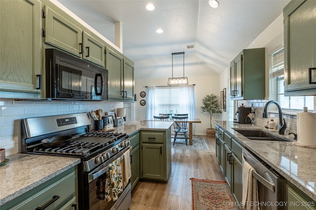 1113 S Spinnaker Dr, Oologah, OK 74053 - kitchen with stainless steel appliances, green cabinets, plenty of natural light, and recessed lighting