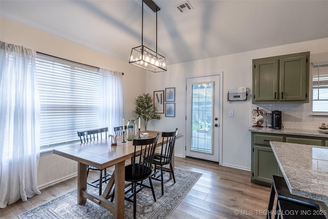 1113 S Spinnaker Dr, Oologah, OK 74053 - dining space with plenty of natural light, light wood-style floors, and a chandelier