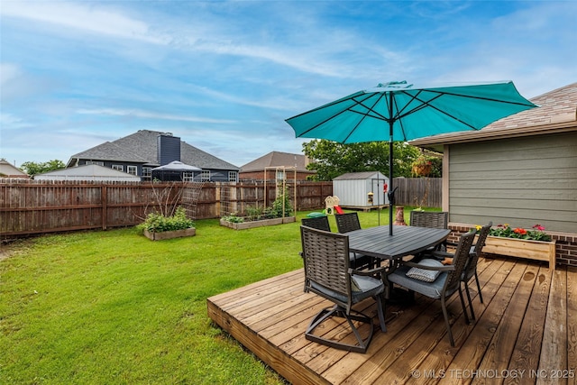 1113 S Spinnaker Dr, Oologah, OK 74053 - wooden deck with a storage unit, outdoor dining space, a garden, and a fenced backyard