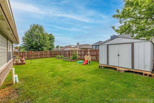 1113 S Spinnaker Dr, Oologah, OK 74053 - fenced backyard featuring a storage shed and a garden