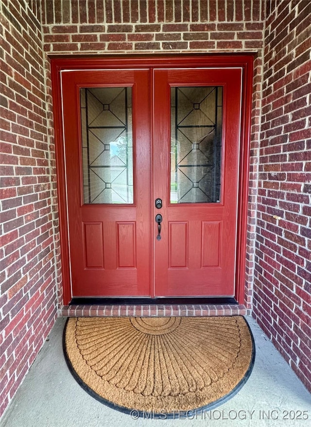 5510 Cooper Ct, Bartlesville, OK 74006 - view of exterior entry with brick siding