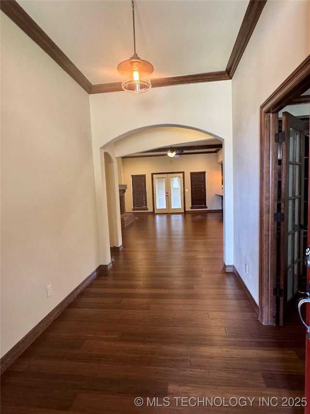 5510 Cooper Ct, Bartlesville, OK 74006 - hallway with arched walkways, crown molding, and dark wood-style floors