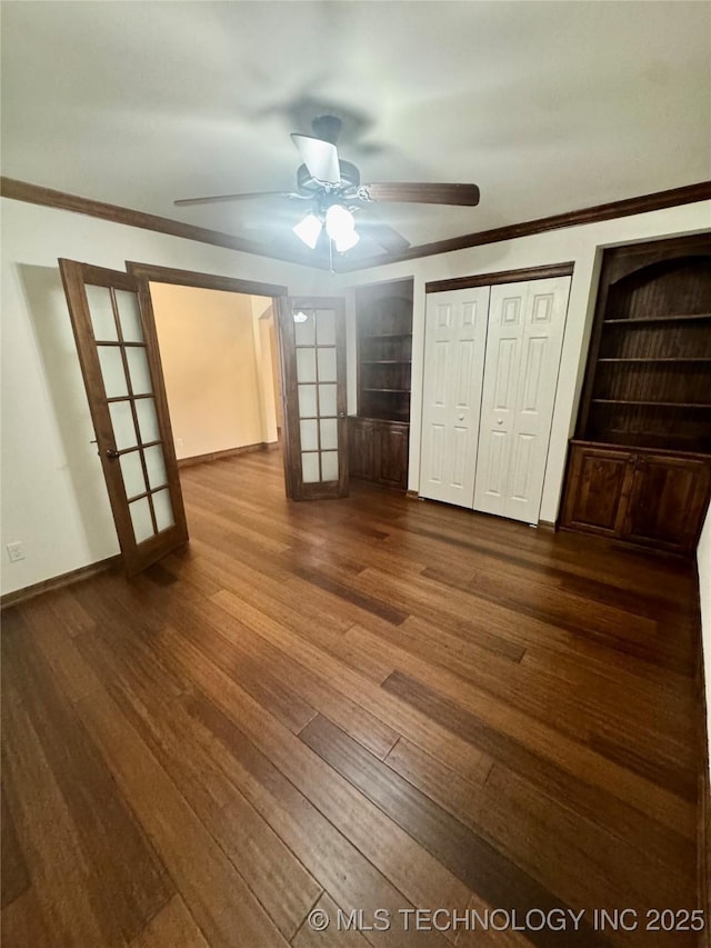 5510 Cooper Ct, Bartlesville, OK 74006 - unfurnished bedroom featuring dark wood finished floors, crown molding, and a ceiling fan