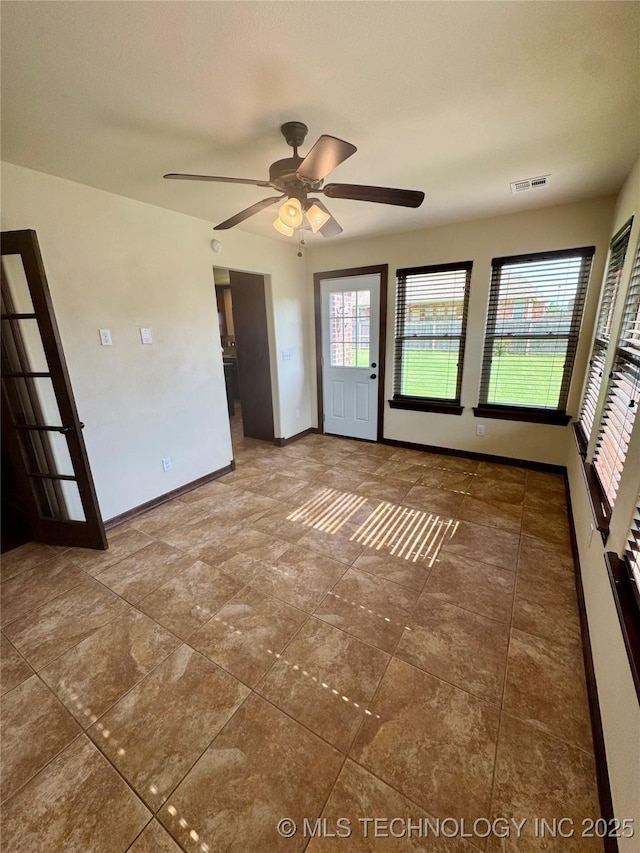 5510 Cooper Ct, Bartlesville, OK 74006 - unfurnished room featuring ceiling fan and healthy amount of natural light