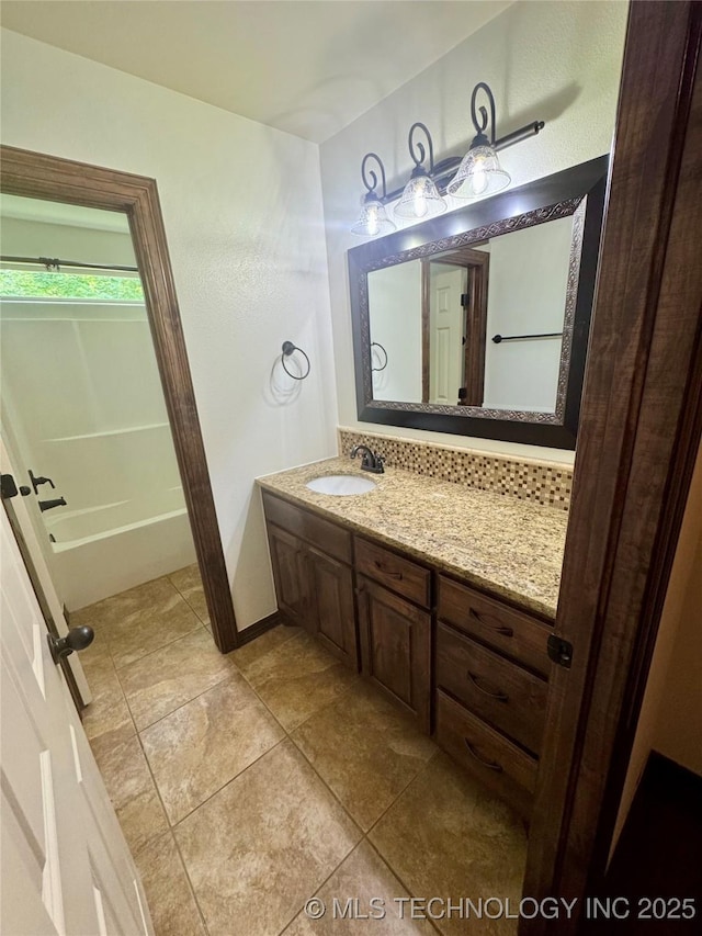 5510 Cooper Ct, Bartlesville, OK 74006 - bathroom with vanity, a tub, and tile patterned floors