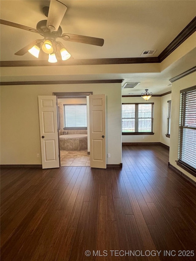 5510 Cooper Ct, Bartlesville, OK 74006 - spare room featuring ornamental molding, ceiling fan, and dark wood finished floors