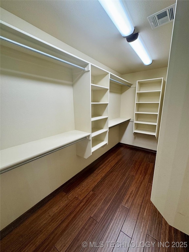 5510 Cooper Ct, Bartlesville, OK 74006 - walk in closet featuring dark wood-style flooring
