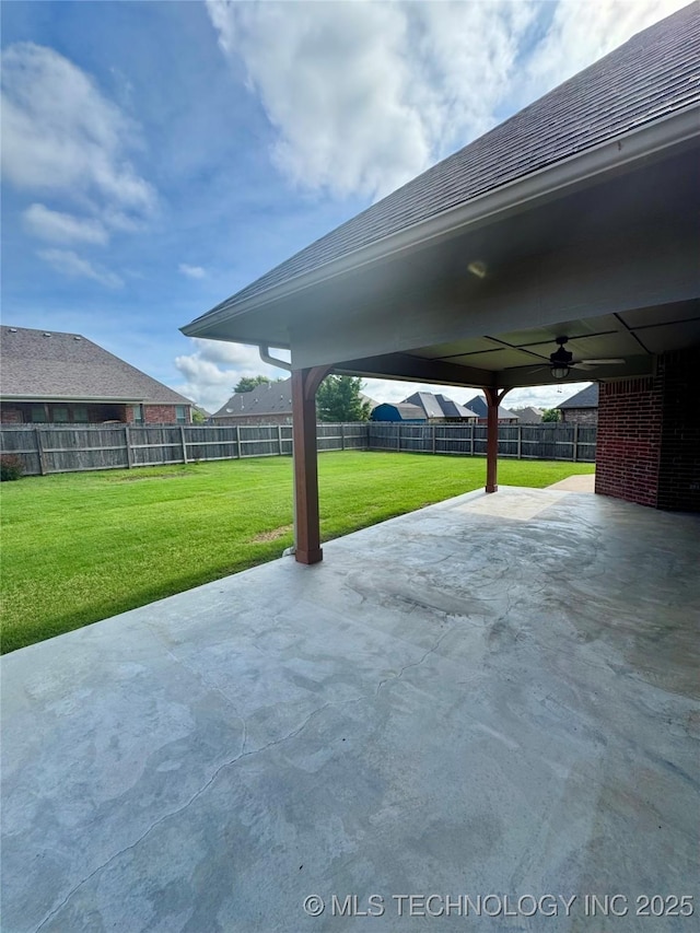 5510 Cooper Ct, Bartlesville, OK 74006 - fenced backyard featuring ceiling fan and a patio area