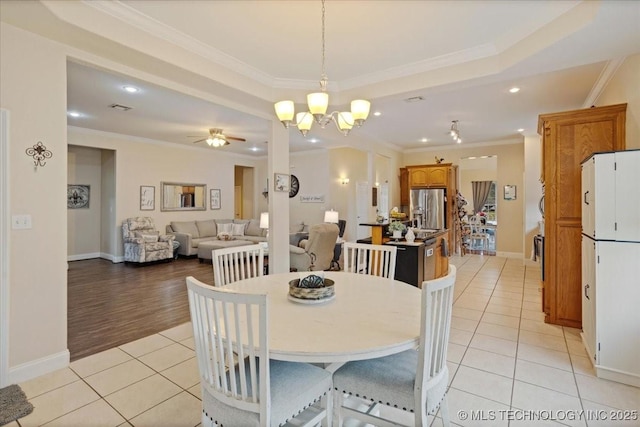 129 Highland Dr, Durant, OK 74701 - dining space with light tile patterned floors, ornamental molding, recessed lighting, a chandelier, and a ceiling fan