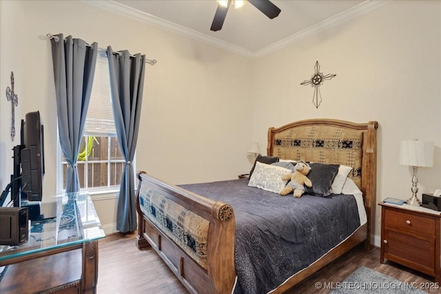 129 Highland Dr, Durant, OK 74701 - bedroom with wood finished floors, crown molding, and ceiling fan
