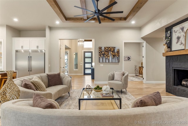 4708 S Sequoia Ave, Broken Arrow, OK 74011 - living area featuring ceiling fan, recessed lighting, light wood-style floors, a fireplace, and beam ceiling
