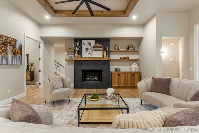 4708 S Sequoia Ave, Broken Arrow, OK 74011 - living room with light wood-type flooring, ceiling fan, a tile fireplace, recessed lighting, and stairway
