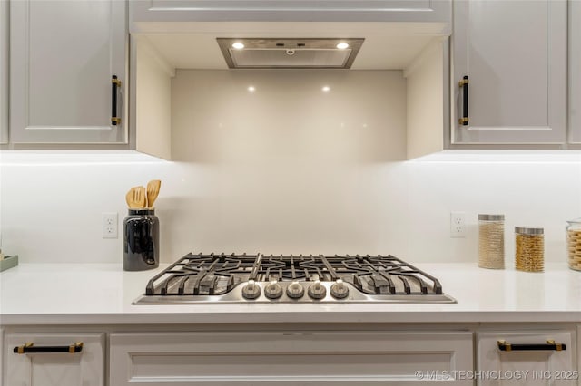 4708 S Sequoia Ave, Broken Arrow, OK 74011 - kitchen view of stainless steel gas stovetop, light countertops, and white cabinetry