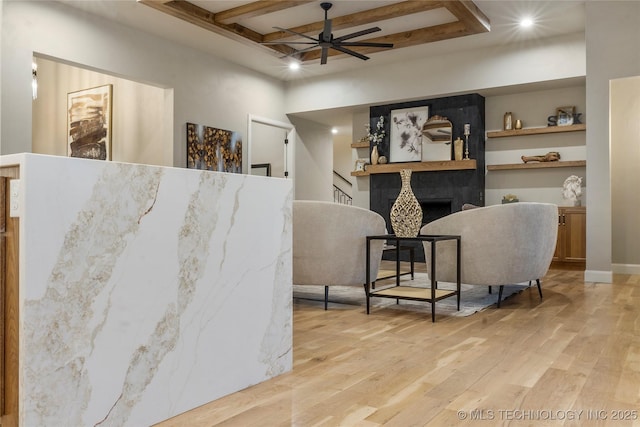4708 S Sequoia Ave, Broken Arrow, OK 74011 - living area featuring wood finished floors, ceiling fan, beamed ceiling, recessed lighting, and a tile fireplace