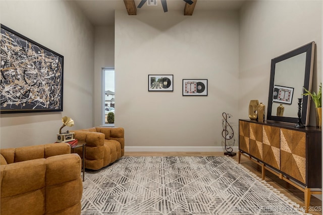 4708 S Sequoia Ave, Broken Arrow, OK 74011 - living area with ceiling fan, wood finished floors, and beamed ceiling
