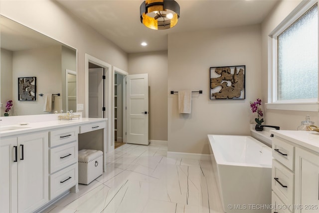 4708 S Sequoia Ave, Broken Arrow, OK 74011 - bathroom featuring a soaking tub, vanity, marble finish floors, and recessed lighting